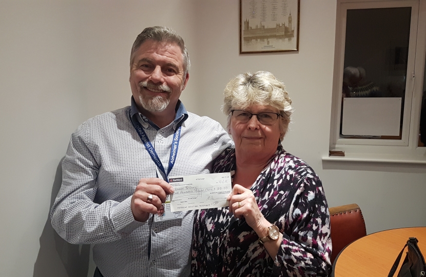 Mrs Bowles being presented with a cheque from Drew Smith, the Chairman of Bassetlaw Conservative Association